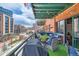 Balcony with comfortable seating and a grill, perfect for outdoor dining and relaxing at 1735 19Th St # 5B, Denver, CO 80202