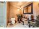 This elegant bathroom features a marble sink, ornate mirror and fixtures, and tiled floors at 1735 19Th St # 5B, Denver, CO 80202