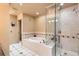 Spa-like bathroom featuring a soaking tub, glass-enclosed shower, and tiled flooring at 1735 19Th St # 5B, Denver, CO 80202