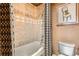 Bathroom features a bathtub, shower, and patterned shower curtain at 1735 19Th St # 5B, Denver, CO 80202