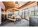 Well-appointed primary bedroom featuring a bed, balcony access, and sophisticated decor at 1735 19Th St # 5B, Denver, CO 80202