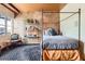 Bedroom features a four-poster bed, exposed beam ceiling, and a shelf at 1735 19Th St # 5B, Denver, CO 80202