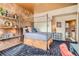 Bedroom features a four-poster bed, exposed beam ceiling, and warm light at 1735 19Th St # 5B, Denver, CO 80202