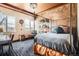 Bedroom features a four-poster bed, exposed beam ceiling, and city views at 1735 19Th St # 5B, Denver, CO 80202