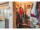 Walk-in closet with clothing, shoe racks, and shelves near a sliding door at 1735 19Th St # 5B, Denver, CO 80202