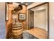 Charming hallway featuring a decorative barrel table, unique wall decor, and convenient elevator access at 1735 19Th St # 5B, Denver, CO 80202