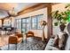 Cozy living area with stylish seating, fireplace, and city views through expansive windows at 1735 19Th St # 5B, Denver, CO 80202