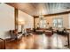 Spacious living area featuring hardwood floors, a decorative ceiling, and ample seating with natural light at 1735 19Th St # 5B, Denver, CO 80202