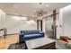 Open lobby area with tile flooring, blue sofa, metal sliding door, light fixture, and coffee table at 1735 19Th St # 5B, Denver, CO 80202