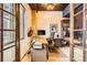 Bright office space with a desk, shelving, and natural light from an exterior window at 1735 19Th St # 5B, Denver, CO 80202