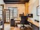Modern office with a large window, custom desk, and ample workspace for productivity at 1735 19Th St # 5B, Denver, CO 80202