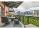 Relax on this stylish patio with comfortable seating and scenic city views at 1735 19Th St # 5B, Denver, CO 80202