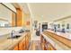 Close up view of the bar, featuring wood cabinets, granite counters and a sink at 501 Young Cir, Castle Rock, CO 80104
