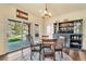 Cozy dining area featuring a cabinet with bar, an outdoor patio, and views of the backyard at 501 Young Cir, Castle Rock, CO 80104