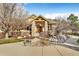 Charming home exterior with stone pillars, wood accents, and a landscaped walkway at 501 Young Cir, Castle Rock, CO 80104