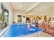 Spacious game room featuring a ping pong table, bar area, and comfortable seating at 501 Young Cir, Castle Rock, CO 80104
