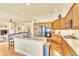 Open concept kitchen with wood cabinets, a granite island with seating and stainless appliances at 501 Young Cir, Castle Rock, CO 80104
