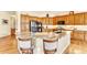 Kitchen island with granite countertops, stainless steel appliances, and wood cabinets at 501 Young Cir, Castle Rock, CO 80104