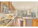 Kitchen featuring granite countertops, island with sink and dishwasher, and mountain view at 501 Young Cir, Castle Rock, CO 80104