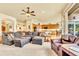 Open-concept living area with a fireplace, large sectional, and connecting kitchen at 501 Young Cir, Castle Rock, CO 80104