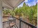 Cozy seating on the balcony, perfect for enjoying peaceful moments surrounded by nature at 24354 Eagle Cliff Trl, Conifer, CO 80433