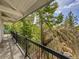 The balcony features a hammock, offering a serene spot to enjoy the surrounding nature and rocky landscape at 24354 Eagle Cliff Trl, Conifer, CO 80433