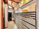 Spacious walk-in closet with plenty of shelving, drawers, and storage space for clothes and accessories at 24354 Eagle Cliff Trl, Conifer, CO 80433