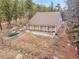 Detached garage with multiple bays offers ample storage and workspace in a serene, wooded setting at 24354 Eagle Cliff Trl, Conifer, CO 80433