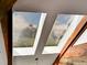 Unique skylight offering picturesque views of the mountains and sky from inside the home at 24354 Eagle Cliff Trl, Conifer, CO 80433