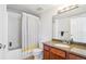 Charming bathroom with granite countertop, vanity lighting, and a shower-tub combination at 100 Park W Ave # 304, Denver, CO 80205