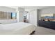 Inviting bedroom with a large window, dresser with television, and closet at 100 Park W Ave # 304, Denver, CO 80205
