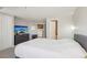 Bright bedroom with en-suite bathroom, television, and closet at 100 Park W Ave # 304, Denver, CO 80205