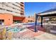 Hot tub and lounge area with building in the background, great for relaxation and socializing at 100 Park W Ave # 304, Denver, CO 80205