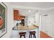 Stylish kitchen with granite countertops, stainless steel appliances, and bar seating for casual dining at 100 Park W Ave # 304, Denver, CO 80205