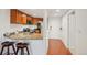 Modern kitchen features granite countertops, stainless steel appliances, and a view of the hallway at 100 Park W Ave # 304, Denver, CO 80205