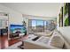 Cozy living room featuring stylish decor, a comfortable sofa, and a sliding glass door that leads to the balcony at 100 Park W Ave # 304, Denver, CO 80205
