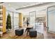 Bright lobby with modern table, decor, and seating, featuring a glimpse of the building's outdoor pool area at 100 Park W Ave # 304, Denver, CO 80205