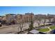 Neighborhood rooftop featuring city views, mature landscaping, and paved sidewalks at 100 Park W Ave # 304, Denver, CO 80205