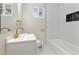 Clean bathroom with white vanity, bathtub and gold fixtures at 1120 Hartford Dr, Boulder, CO 80305