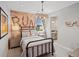 This bedroom has a metal bed frame, unique lighting, and a custom artistic headboard at 1291 Fountain Ln, Erie, CO 80516
