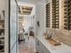 Stylish dining area and wine rack, perfect for entertaining, with view into dining area at 1291 Fountain Ln, Erie, CO 80516