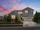 Beautiful two-story home with a well-manicured lawn, lovely landscaping, and a charming stone accents at 1291 Fountain Ln, Erie, CO 80516