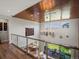 Bright, open foyer showcases wood ceiling, glass railing, and sightlines to both a dining room and an outdoor terrace at 1291 Fountain Ln, Erie, CO 80516
