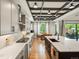 Bright kitchen with modern appliances, a large island, and plenty of counter space with an adjacent dining space at 1291 Fountain Ln, Erie, CO 80516