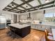 Spacious kitchen with a large island, stainless steel appliances, and custom ceiling with pendant lights at 1291 Fountain Ln, Erie, CO 80516