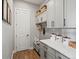 This well-organized mudroom boasts custom cabinetry, storage baskets, and modern decor at 1291 Fountain Ln, Erie, CO 80516