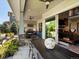 This outdoor kitchen has a dining space with a ceiling fan that is perfect for backyard barbecues at 1291 Fountain Ln, Erie, CO 80516