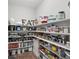 Organized pantry with shelving for ample food and supply storage at 1291 Fountain Ln, Erie, CO 80516