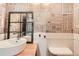 Unique bathroom with newspaper print wallpaper, floating sink, and framed mirror at 13265 Raritan St, Denver, CO 80234