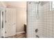 Bathroom featuring tiled shower with modern fixtures and a gray vanity at 13265 Raritan St, Denver, CO 80234